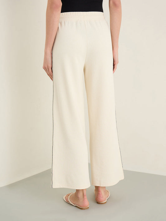 Iconic Cream Self Design Straight Fit Stretchable Trouser