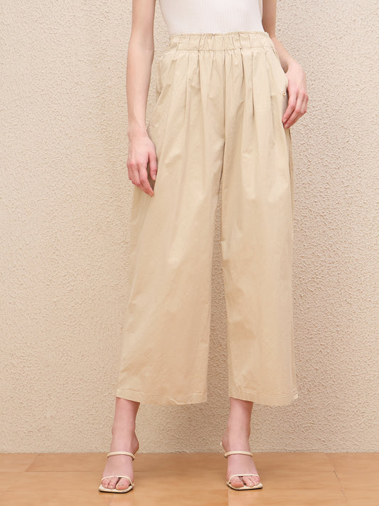 Iconic Women Beige Baggy Fit Solid Trouser